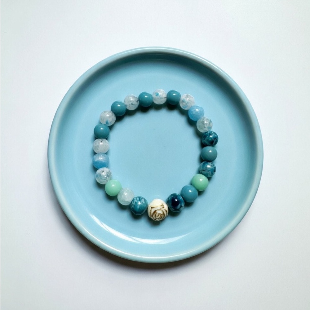 Blue and Aqua Beaded Stretch Bracelet with Carved Accent